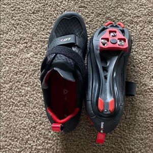 Black and red Reebok cycling shoes